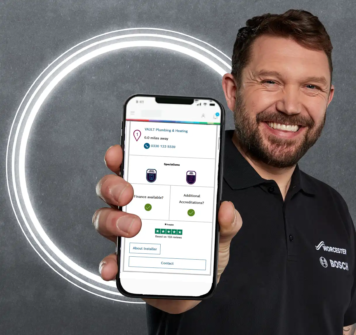 Installer holding phone with VAULT on screen